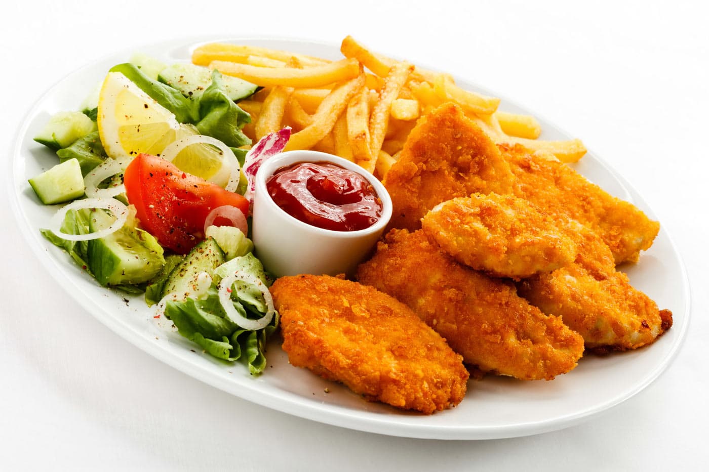 Chicken nuggets with fries and salad